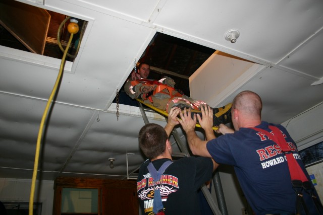 Kyle Goldman, Peter Nash, and Jonathon McKee assist in lowering a patient from the attic during Training/House Burn Nov 12, 2006
Transco Road